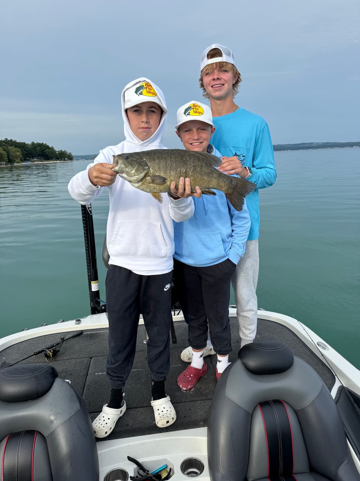 Three boys with big bass catches