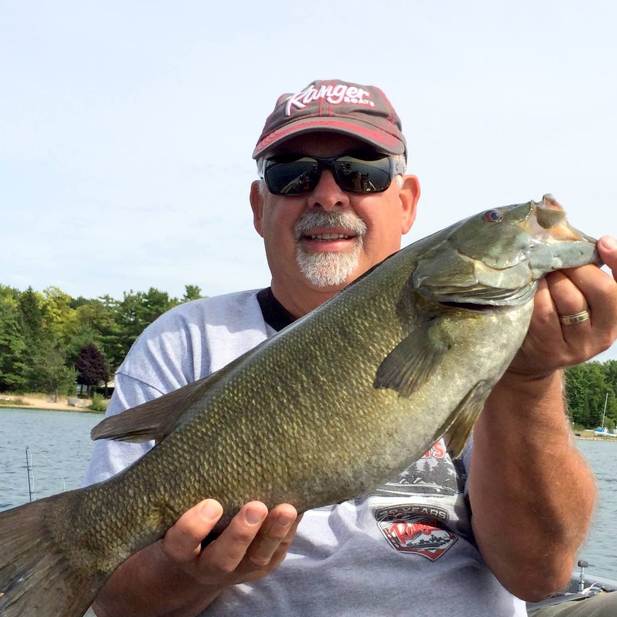 Captain Butch holding a large smallmouth bass